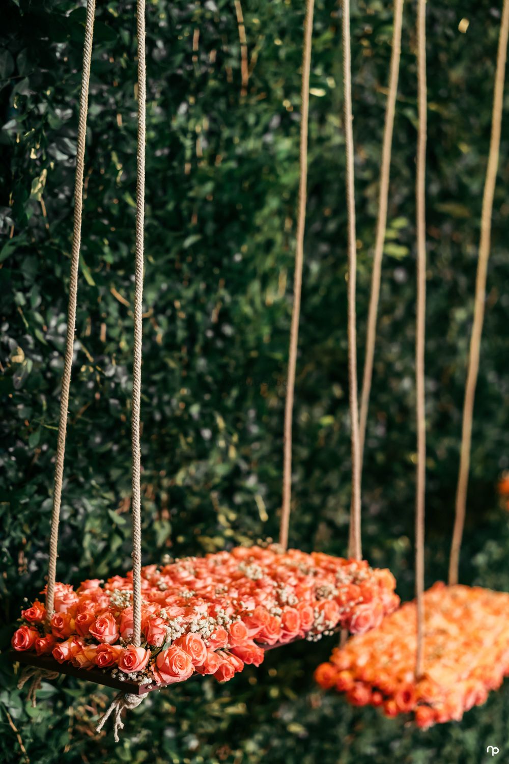 Photo of Floral decor idea with swing for engagement