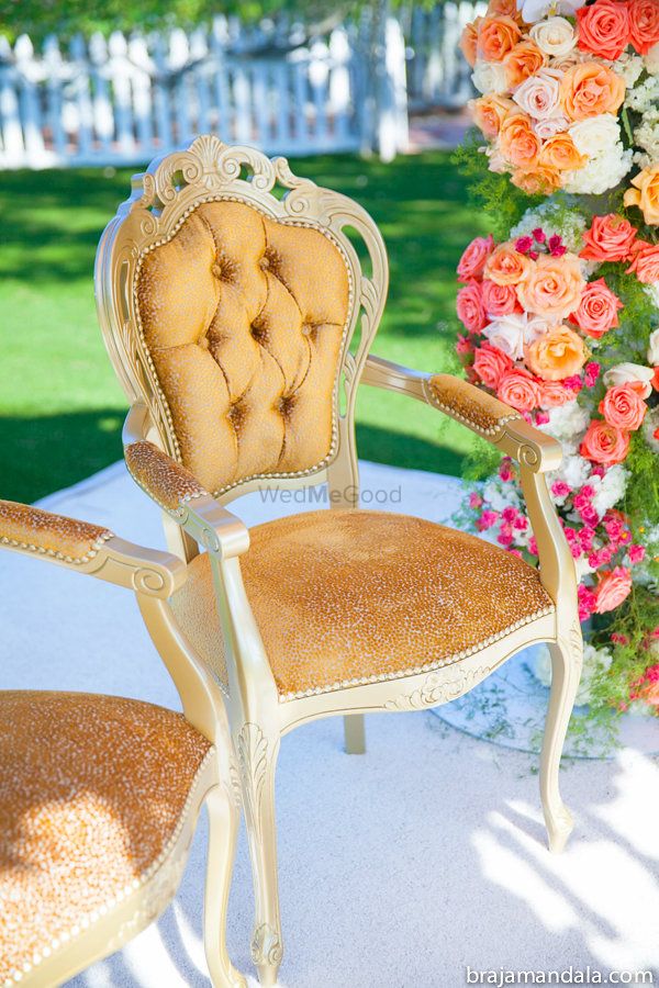 Photo of Gold cushion chair at mandap
