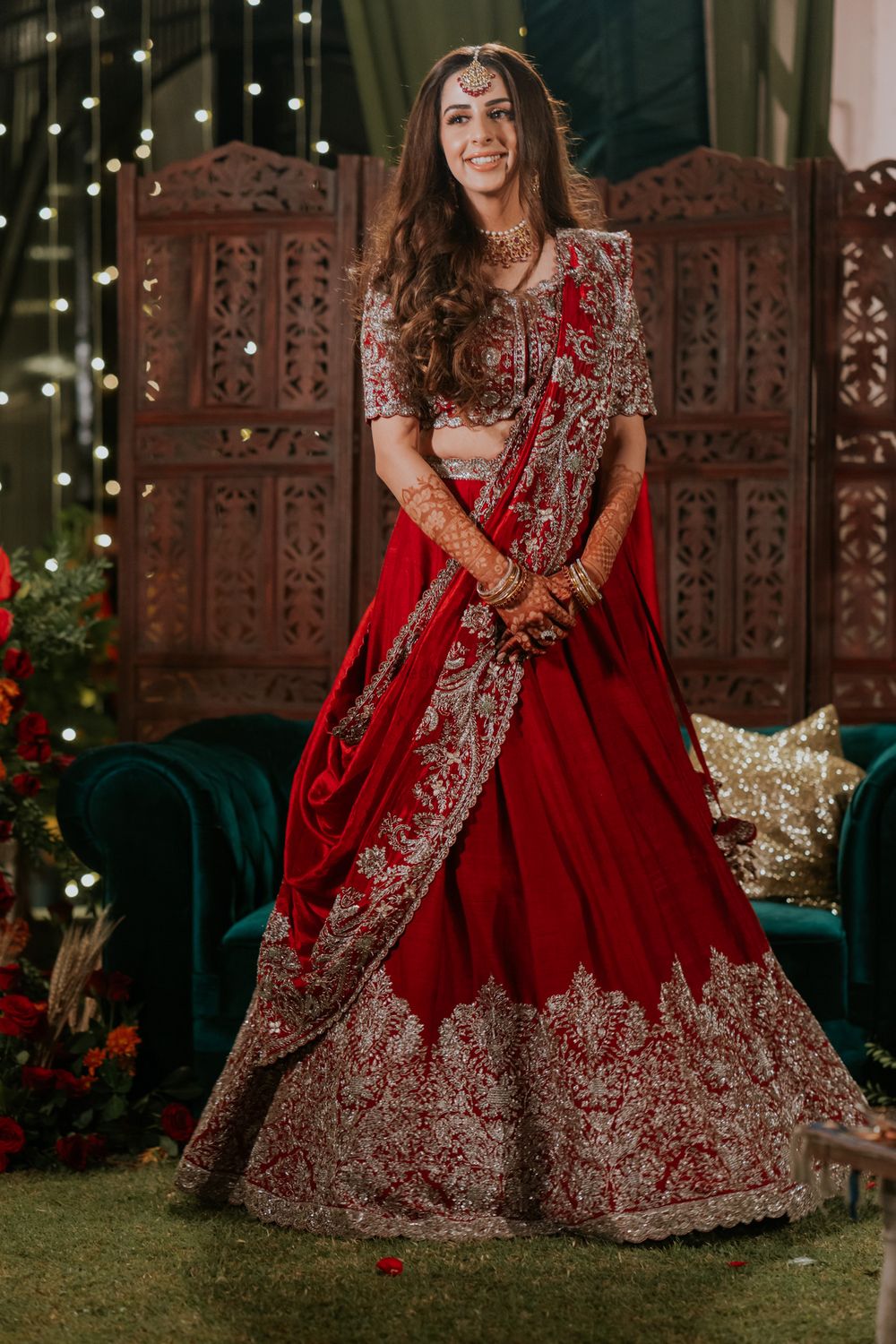 Photo of bride in red lehenga with golden embroidery