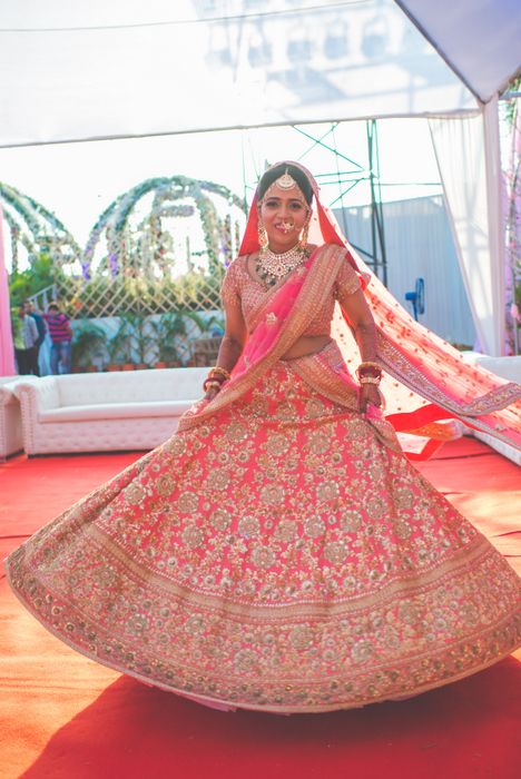 Photo of Pink and gold sabyasachi bridal leheng