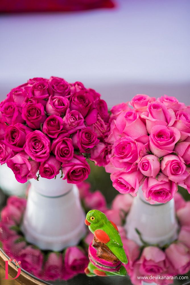 Photo of Pink roses as table centerpieces