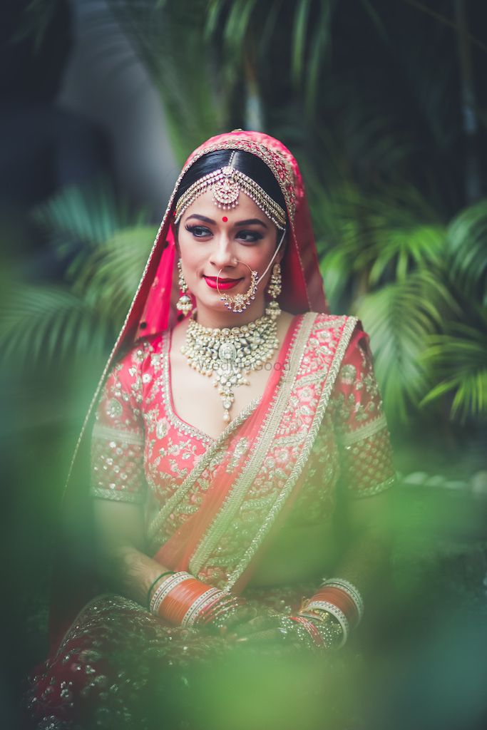 Photo of Bridal portrait in red bridal lehenga and simple jewellery