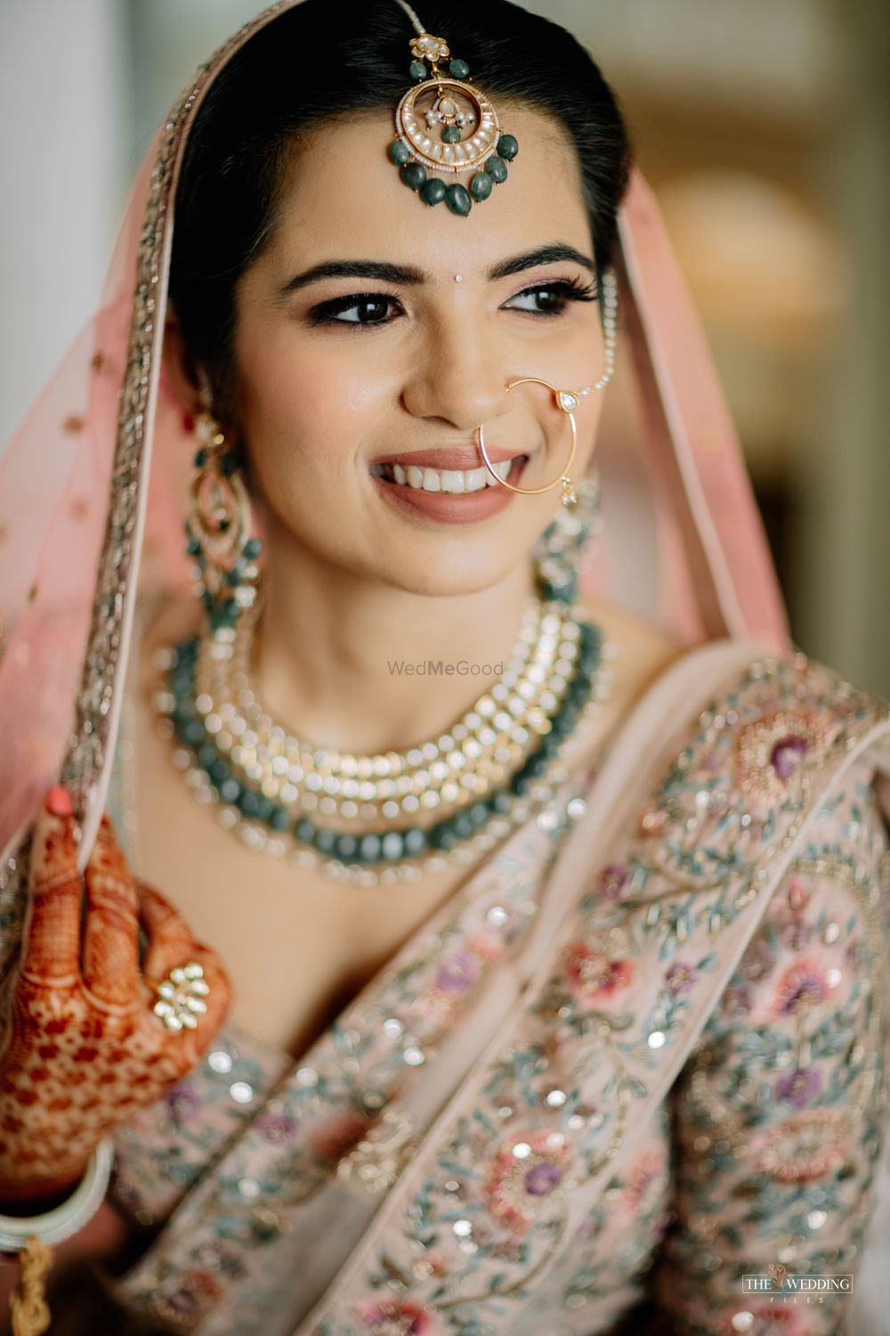 Photo of Bride holding her dupatta and posing.
