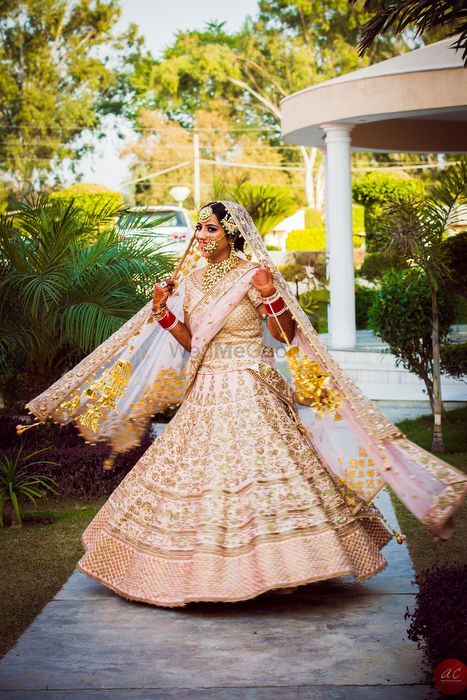 Photo of Sikh Bride in Pastel Pink Twirling Lehenga