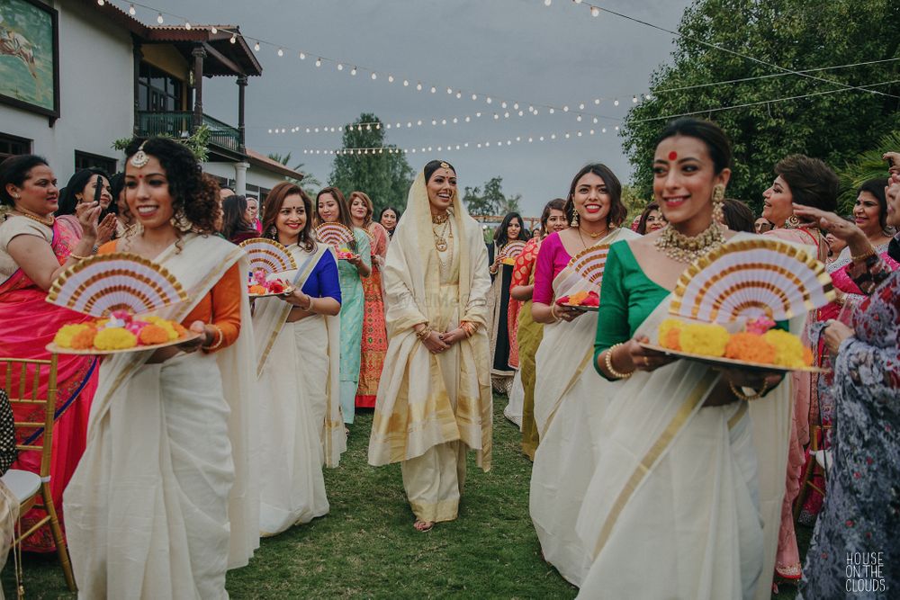 Photo of Bride entering with her coordinated bridesmaids.