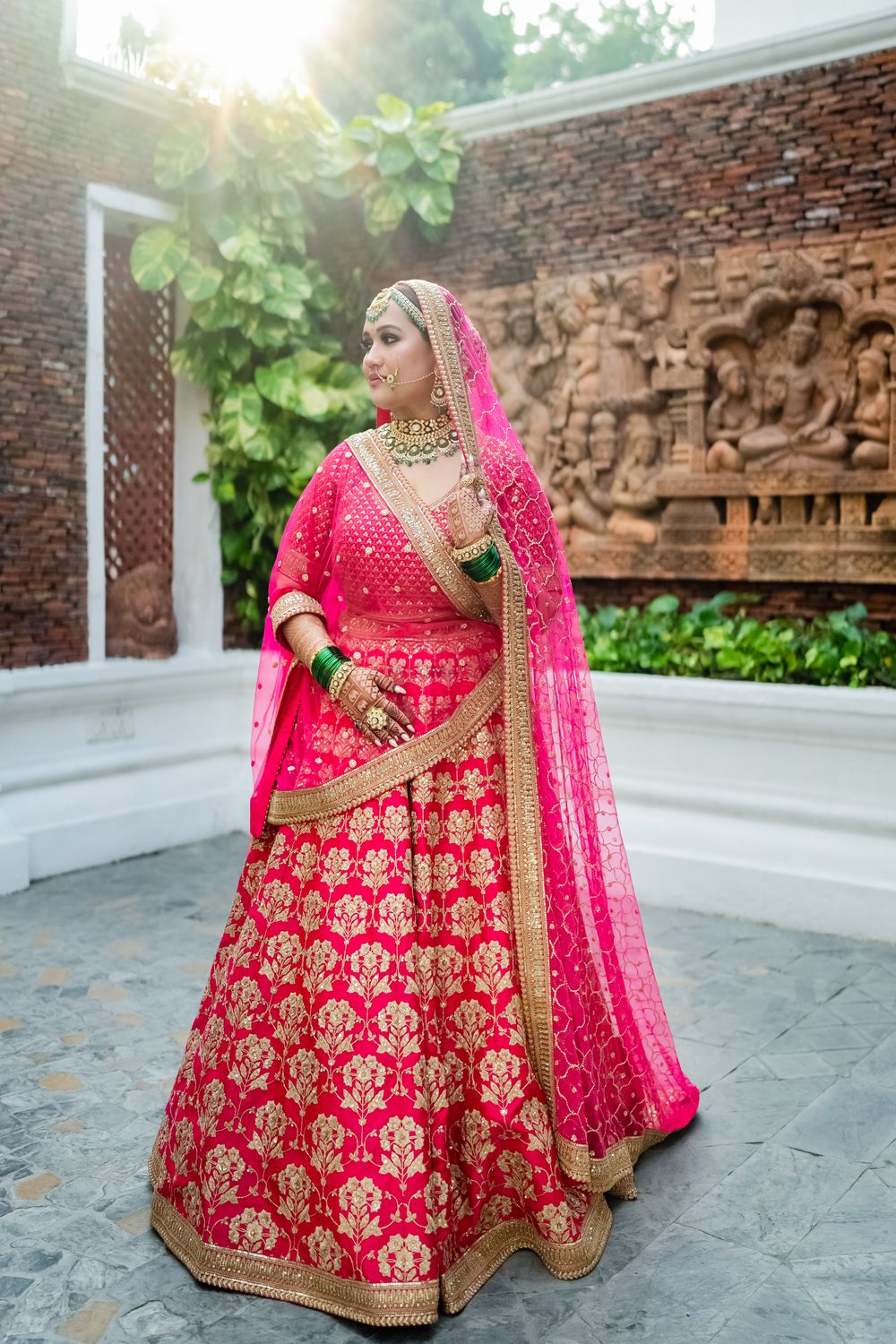 Photo of Bride in a timeless pink wedding lehenga