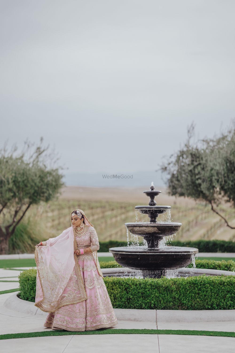 Photo of bridal portrait on wedding day in pink lehenga