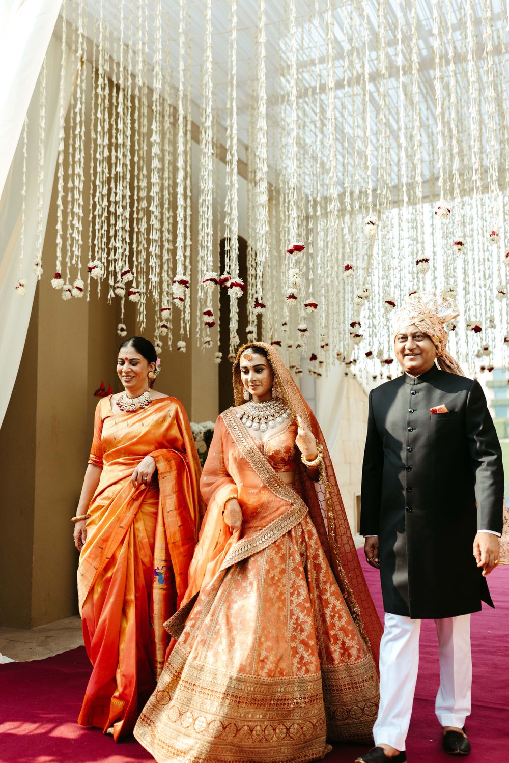 Photo of bride entering with parents