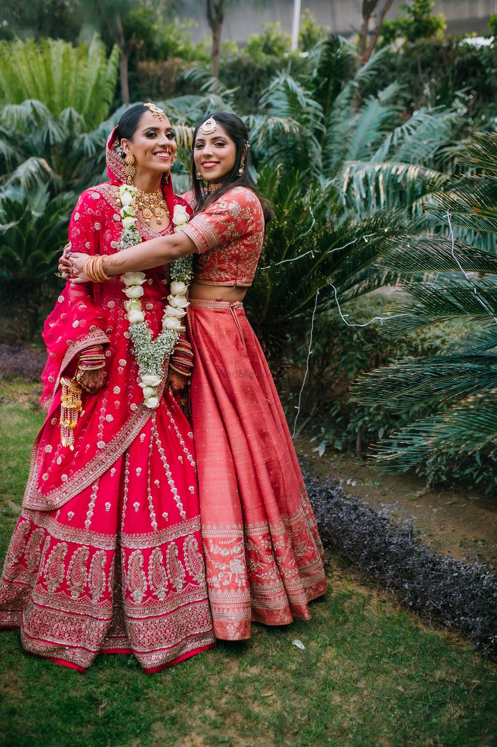 Photo of Bride with sister on the wedding day.