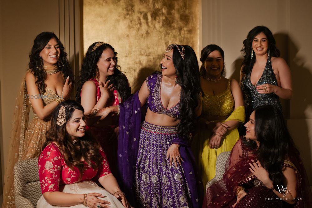 Photo of Fun shot of the bride with her bridesmaids on the sangeet night
