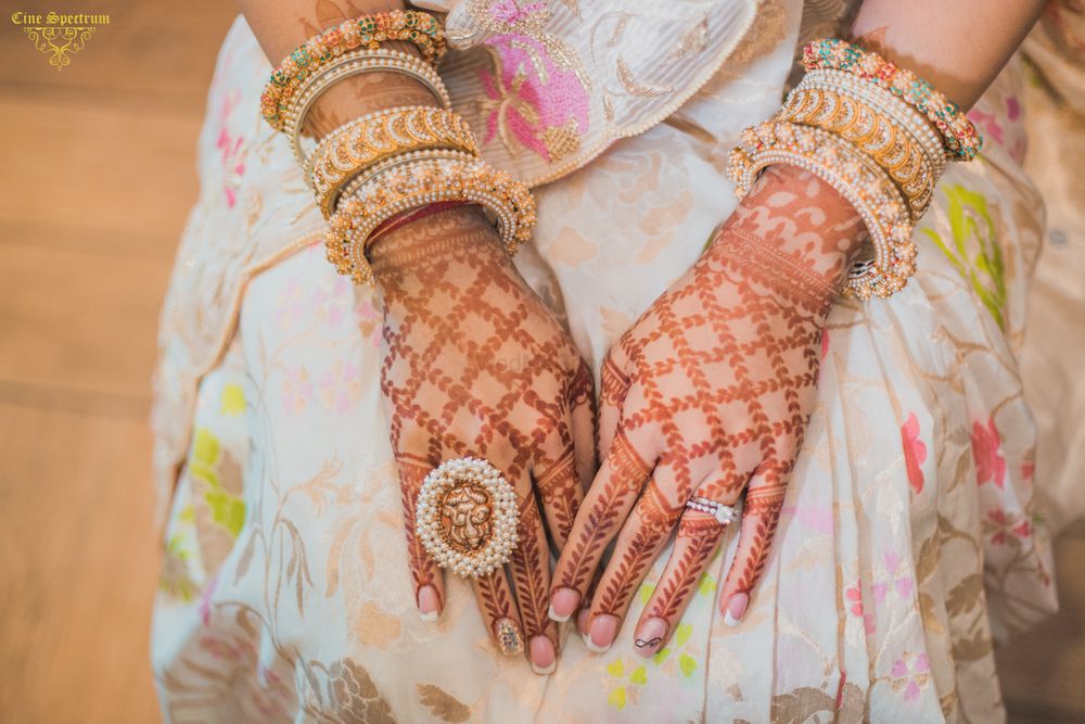 Photo of Bridal hands with temple jewellery cocktail ring