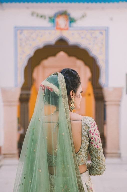 Photo of Bride back shot in offbeat bridal colour