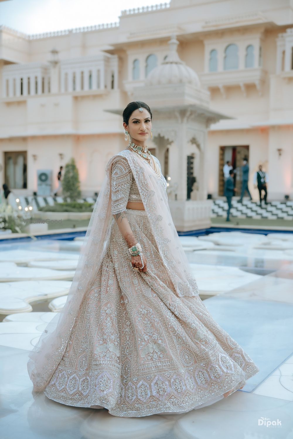 Photo of Peach and white pastel lehenga for the mother of bride look