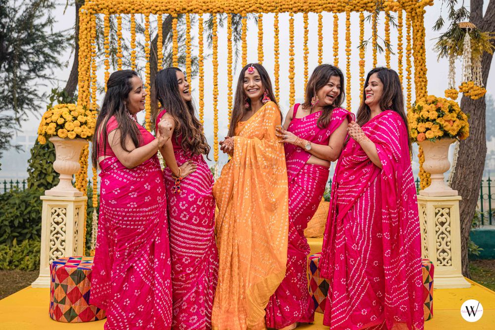 Photo of bride and bridesmaids on haldi in bandhani sarees
