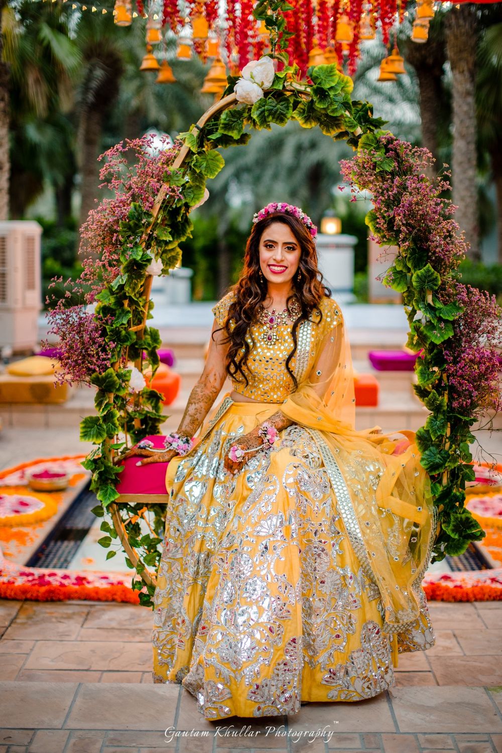 Photo of Stunning silver and yellow bridal lehenga with floral wreath for mehendi
