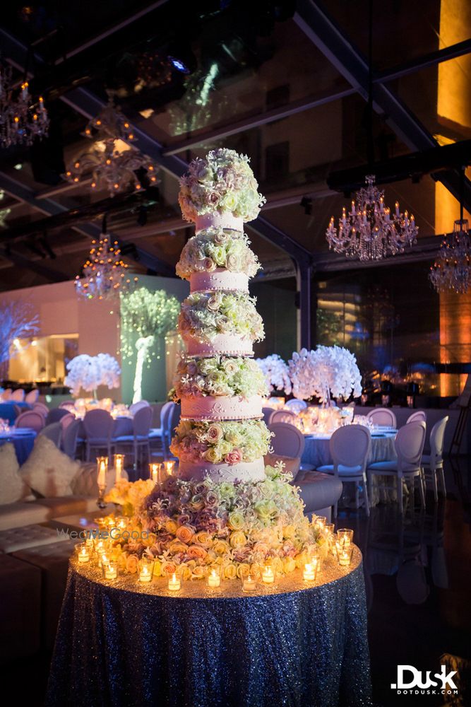 Photo of Multi layered white wedding cake