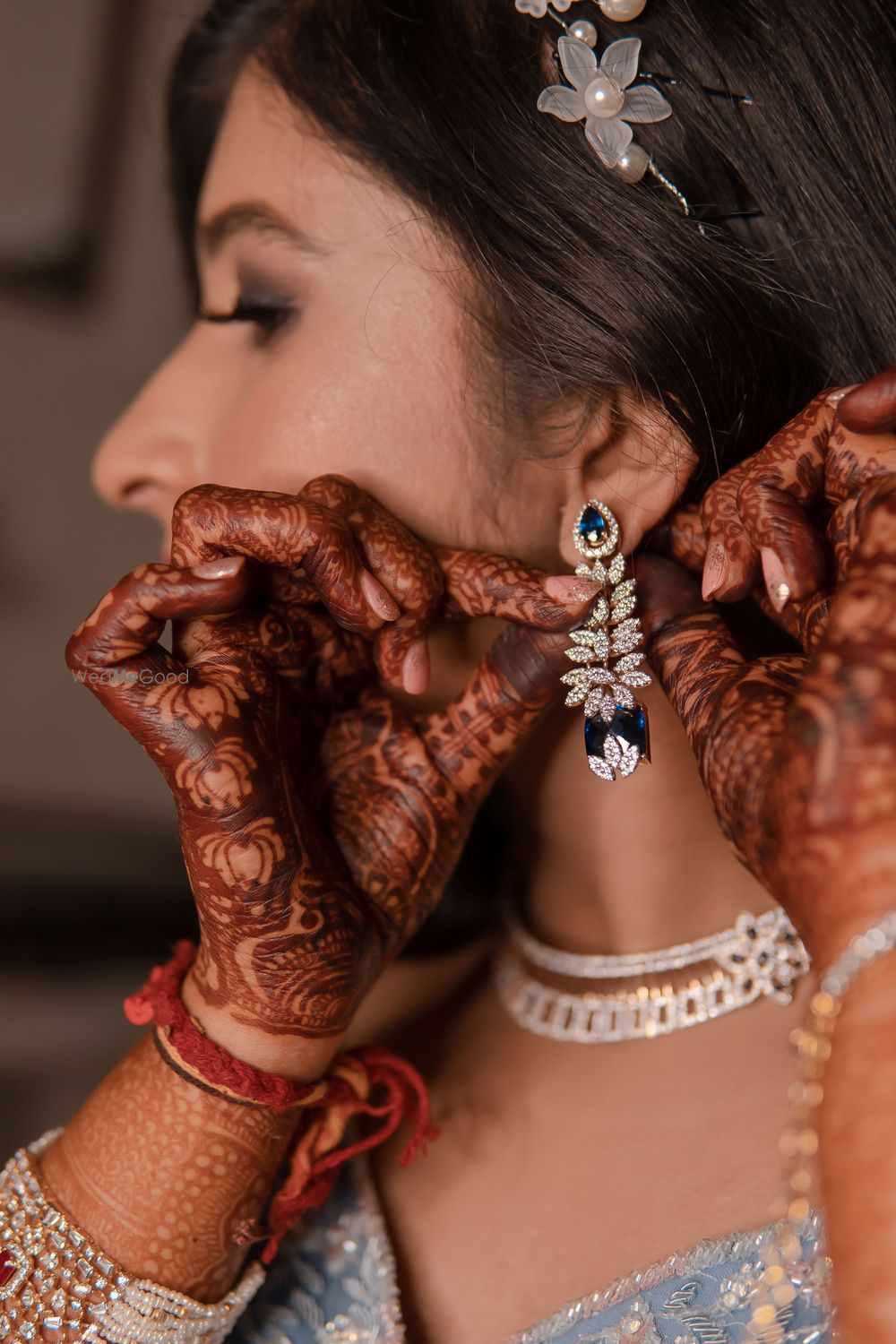 Photo of sangeet or reception bridal earrings with sapphire and diamonds