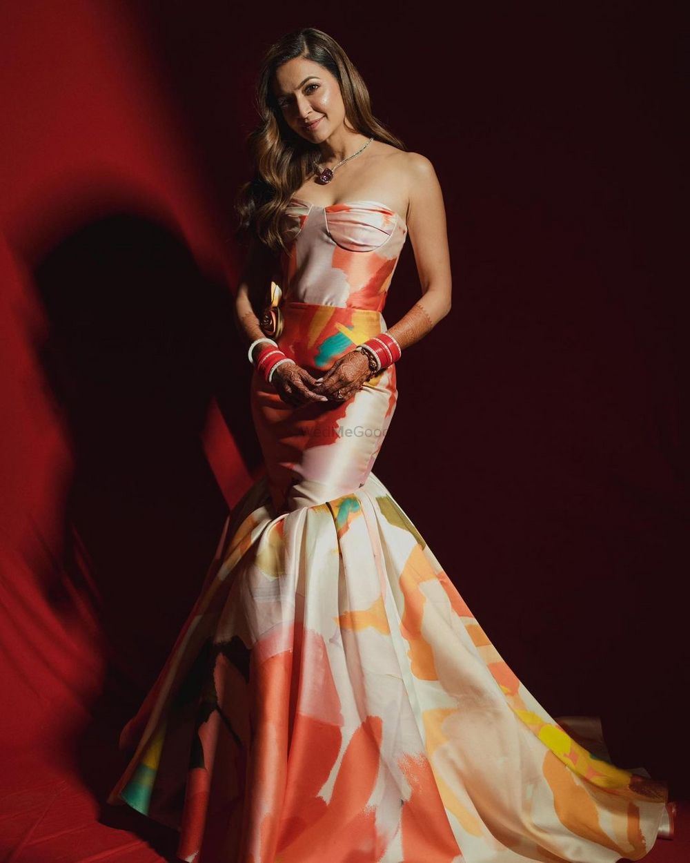 Photo of Gorgeous multi-coloured strapless grown with a mermaid style hemline and a red bridal chooda