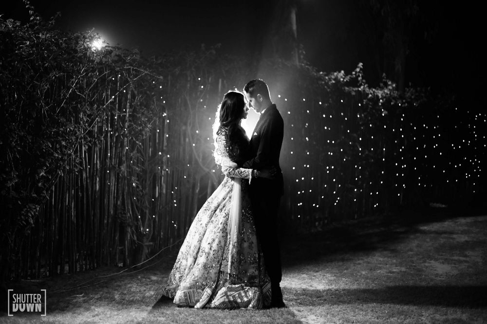 Photo of Black and white couple portrait on Sangeet
