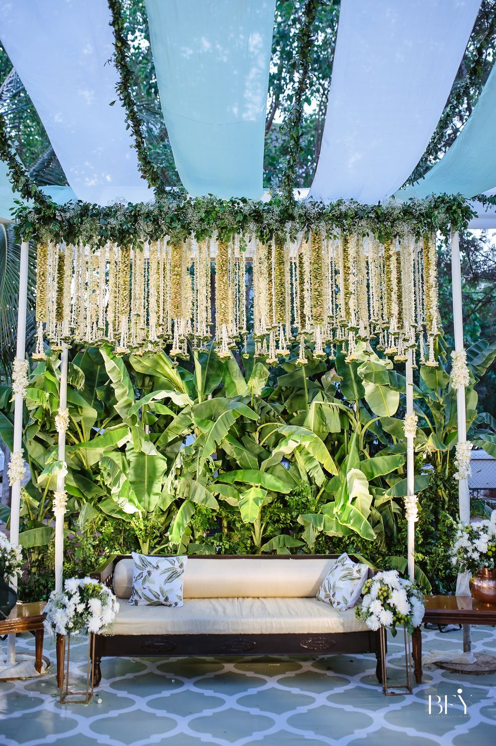 Photo of beautiful mehendi stage with hanging floral decor