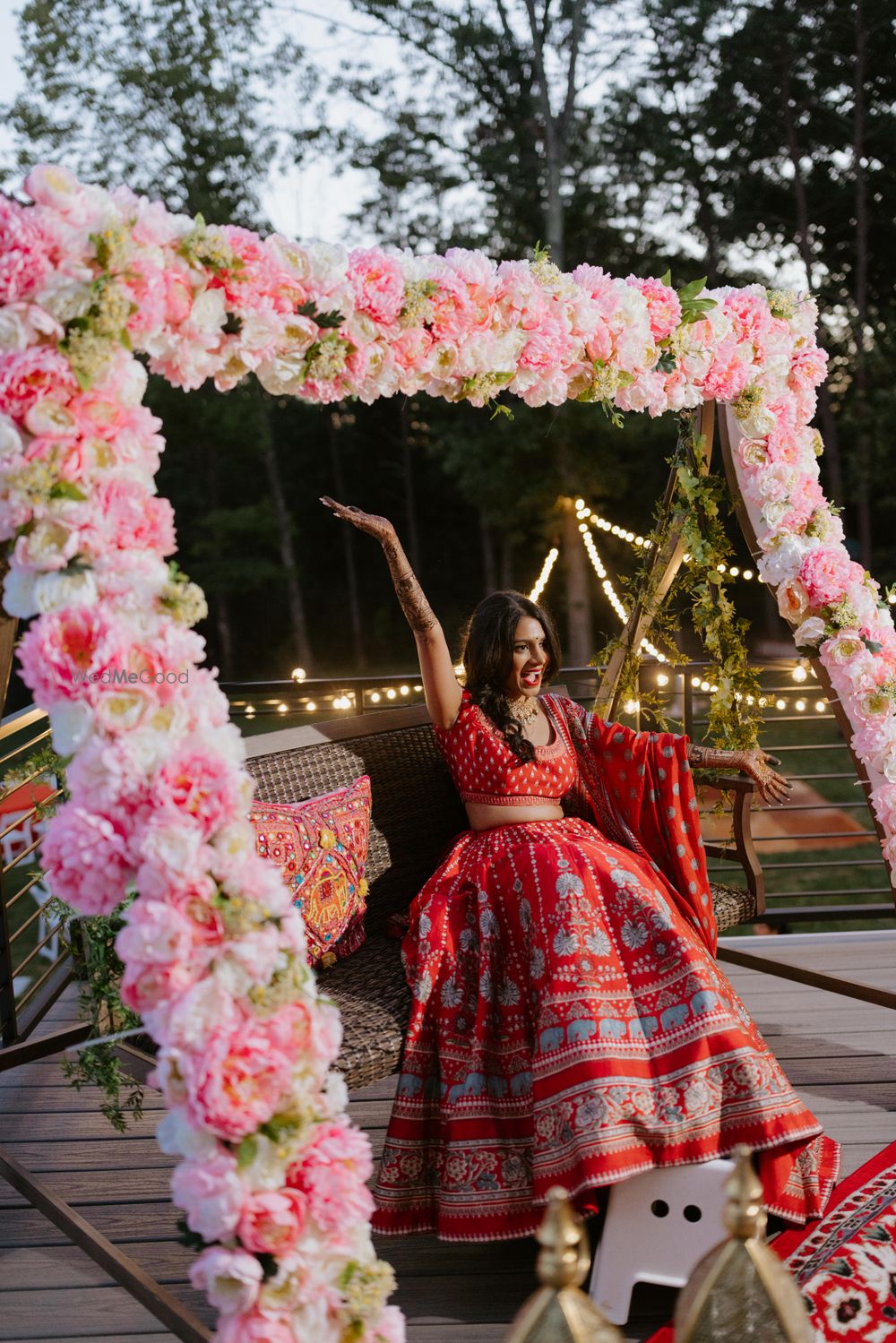 Photo of floral mehendi seating for bride