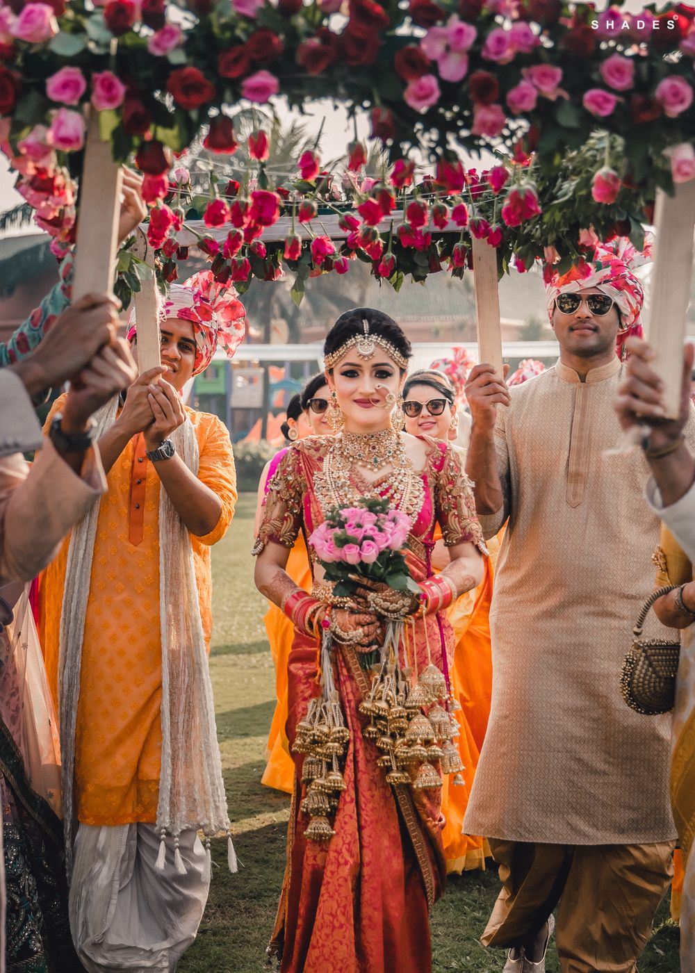 Photo of South indian bridal entry under phoolon ki chadar