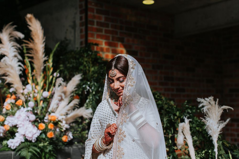 Photo of Bride in a white lehenga