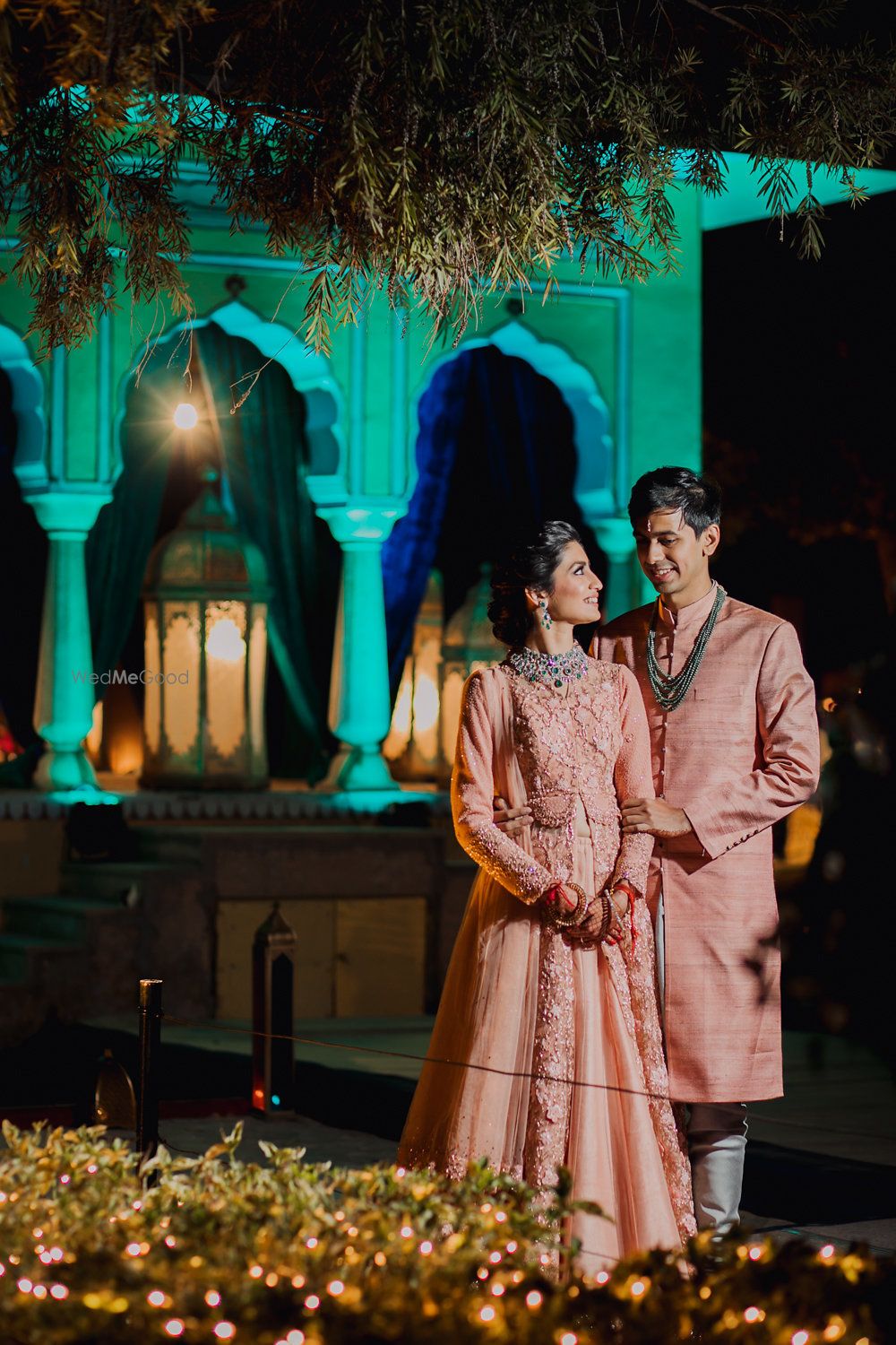 Photo of Engagement couple shot in matching peach