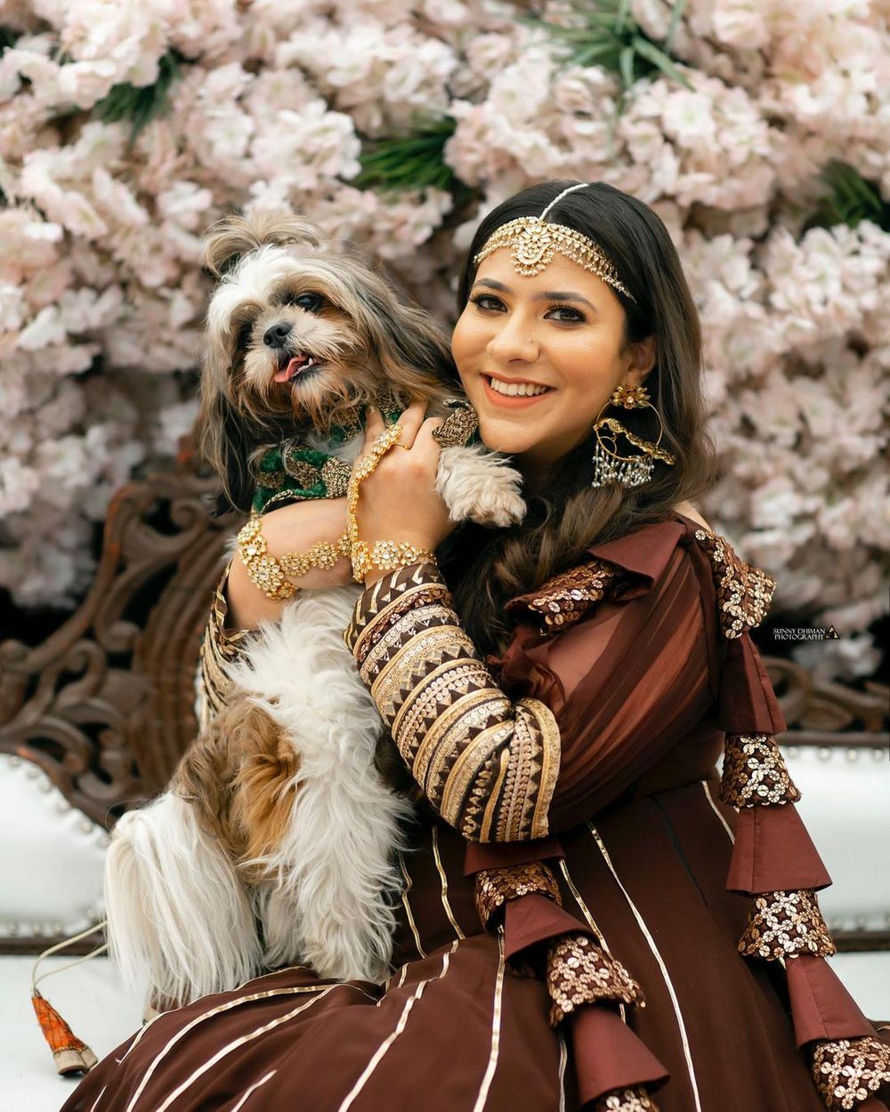 Photo of Bride posing with her dog.