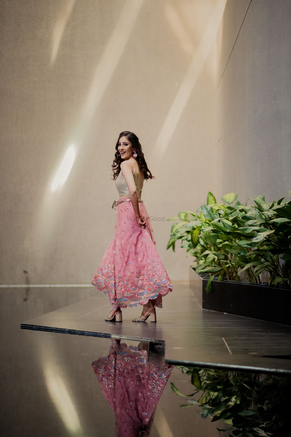 Photo of bride in pink lehenga