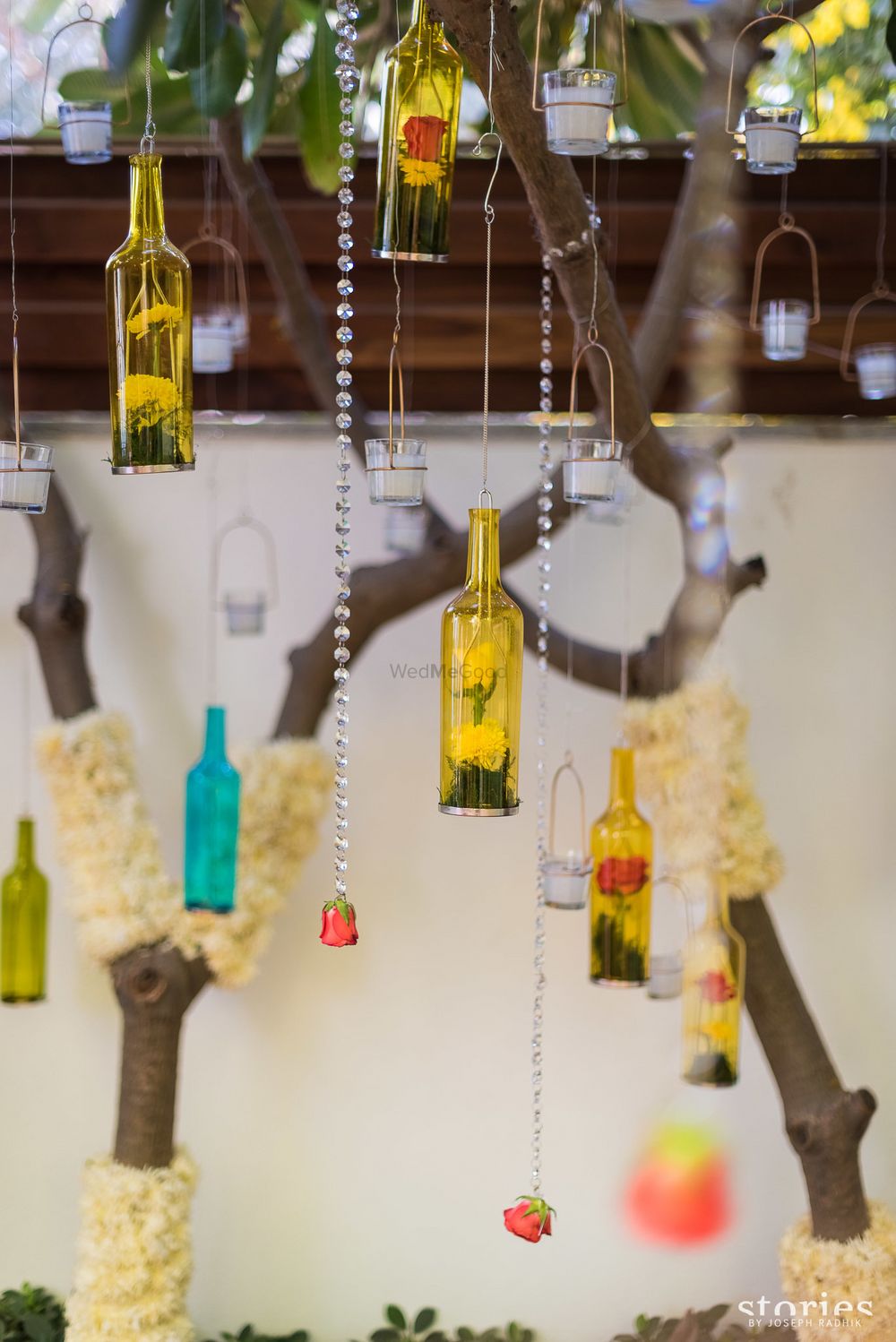 Photo of Suspended bottles with florals for haldi