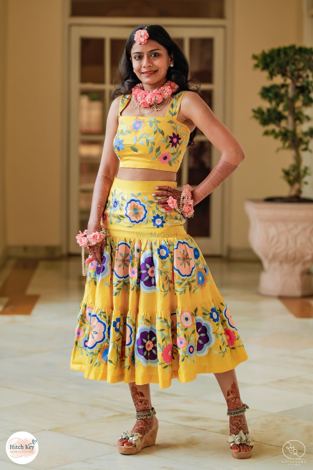Photo of Bridal haldi outfit with floral artwork