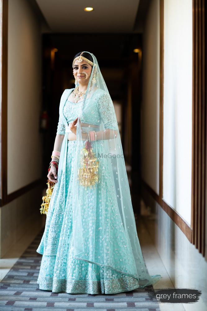 Photo of Pretty bride in light blue lehenga with sequin work