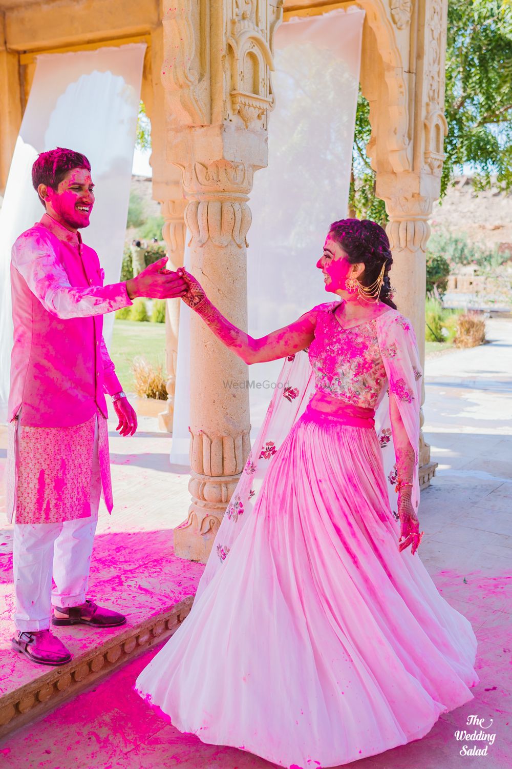 Photo of couple shot drenched in holi colours on their mehendi