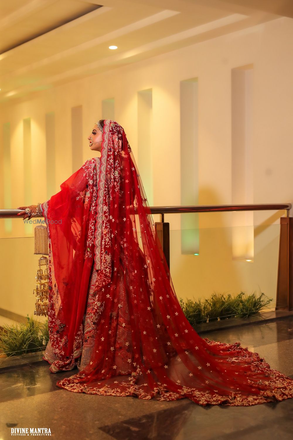 Photo of red bridal lehenga with a train for punjabi bride