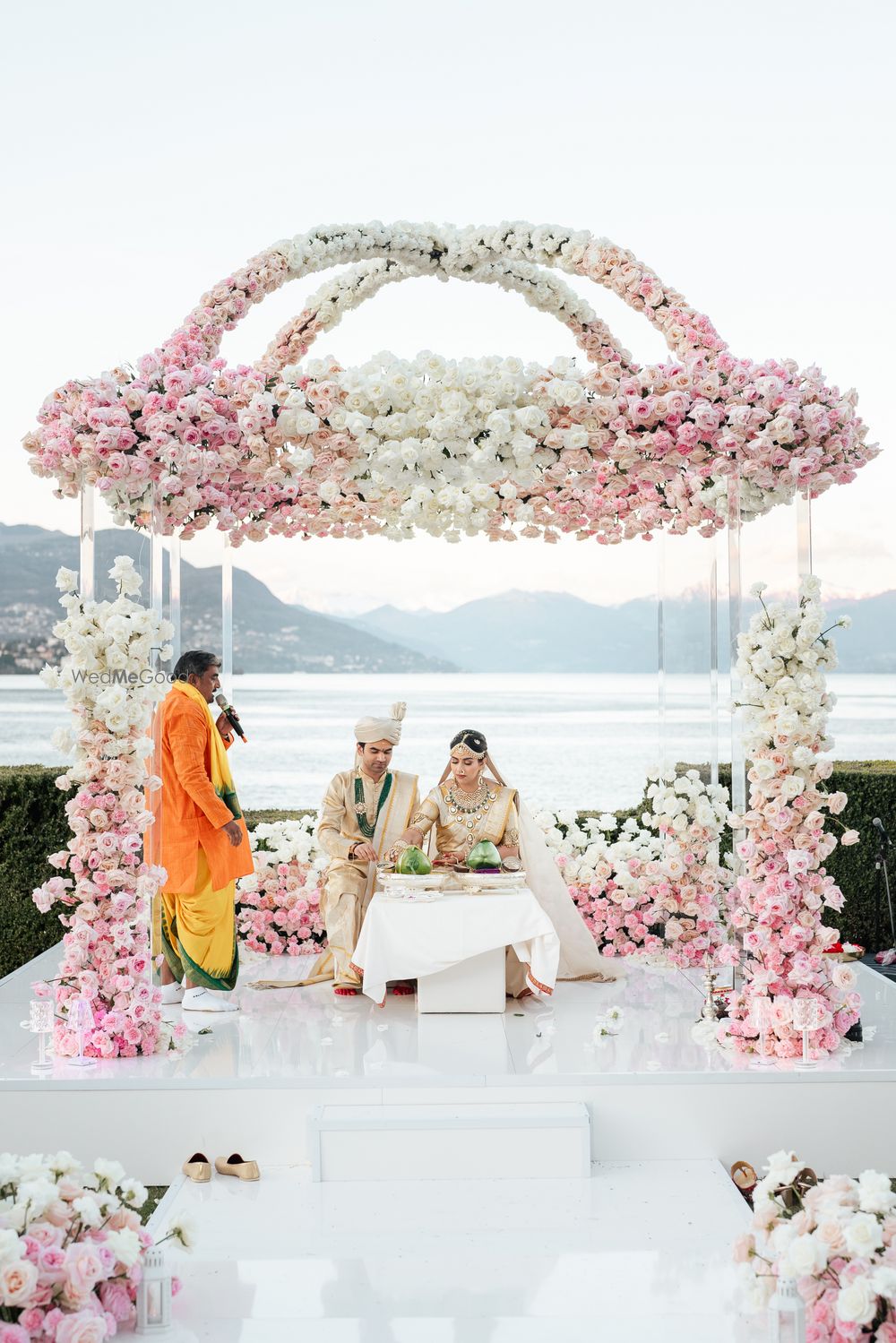 Photo of Lovely pastel pink and white floral mandap decor for this outdoor mandap