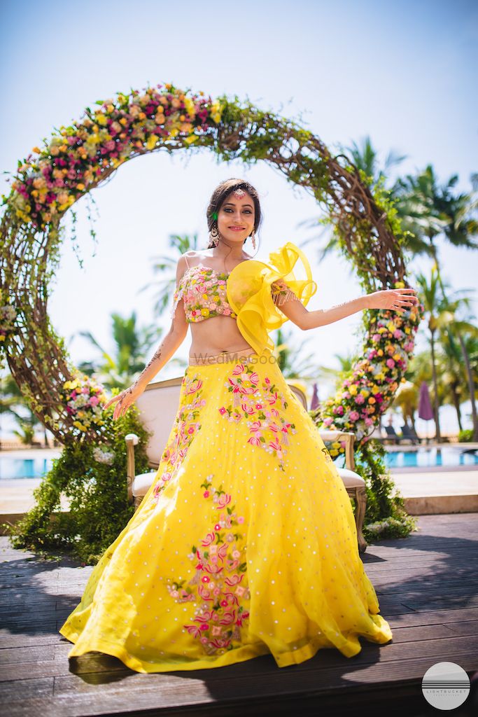 Photo of A bride to be in yellow lehenga
