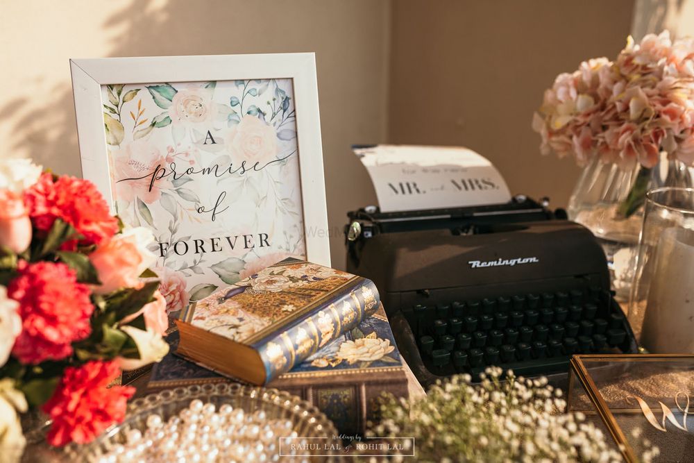Photo of Vintage personalized décor on a table with a typewriter.