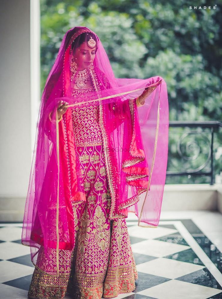 Photo of fuschia pink bridal outfit