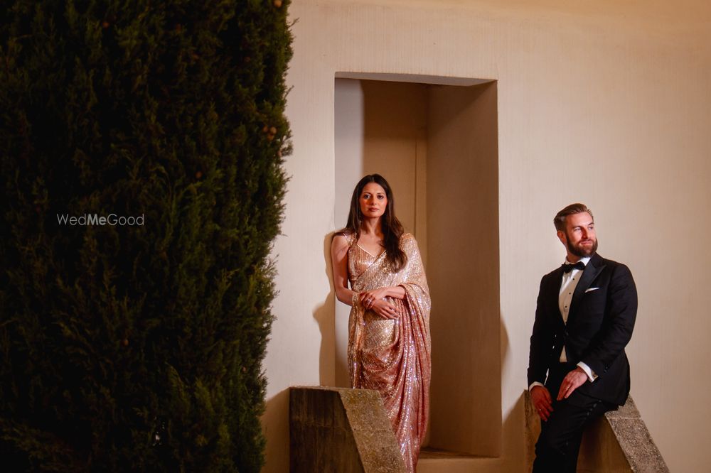 Photo of Gorgeous gold and pink shimmery sequin saree with a halter neck blouse for the pre-wedidng festivities