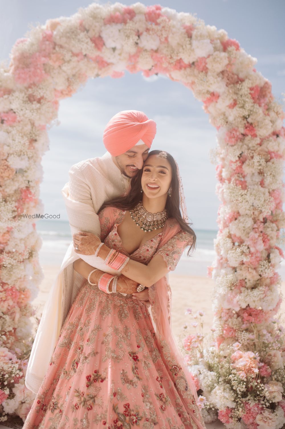 Photo of Happy couple shot in a pastel theme day wedding