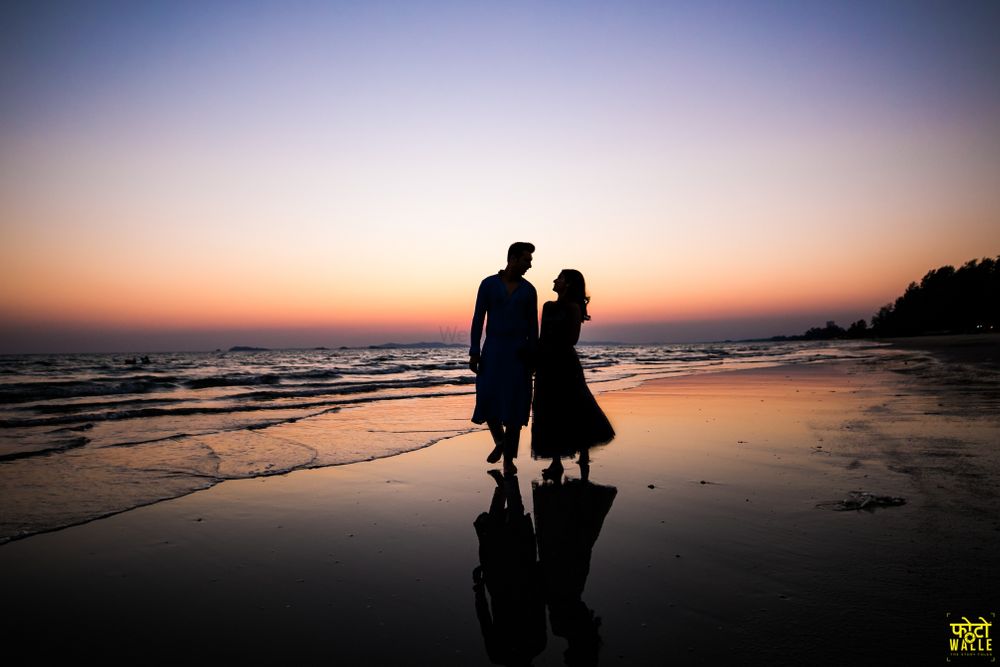 Photo of silhouette pre wedding or honeymoon shot on the beach
