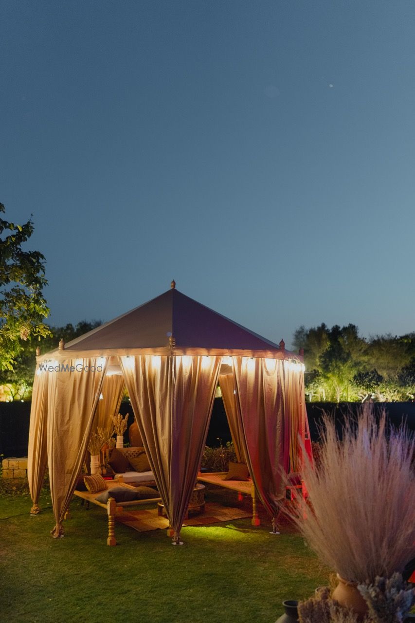 Photo of Gorgeous tent decor seating idea with lights in the outdoors.