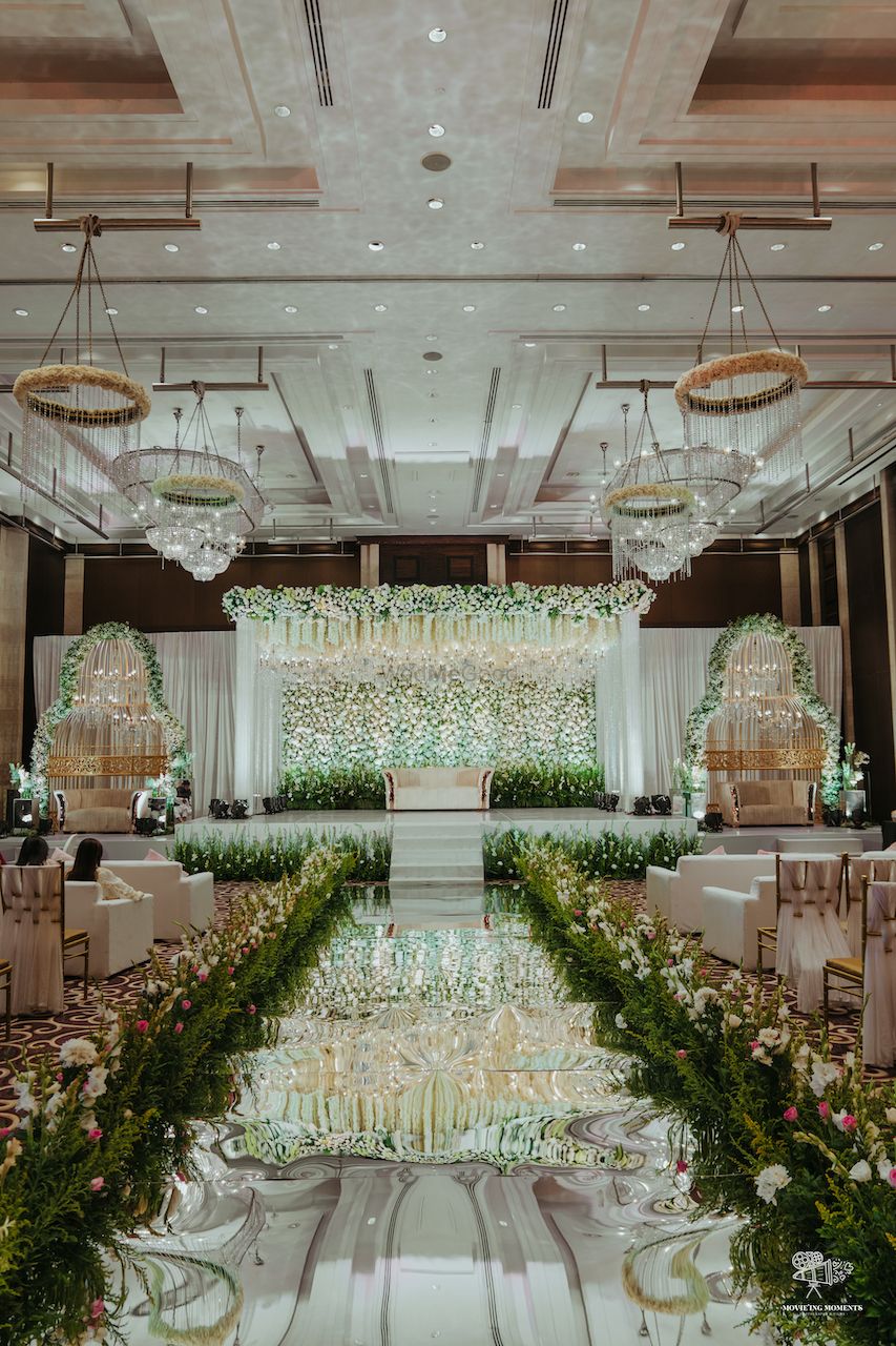 Photo of floral wall stage decor idea with white and green theme