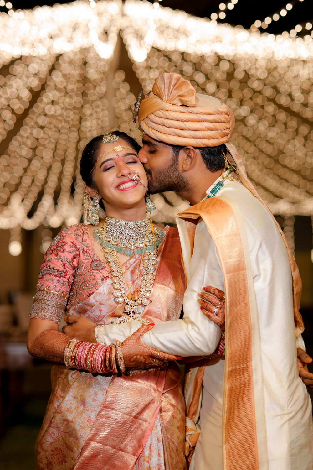 Photo of Mushy South Indian couple shot.