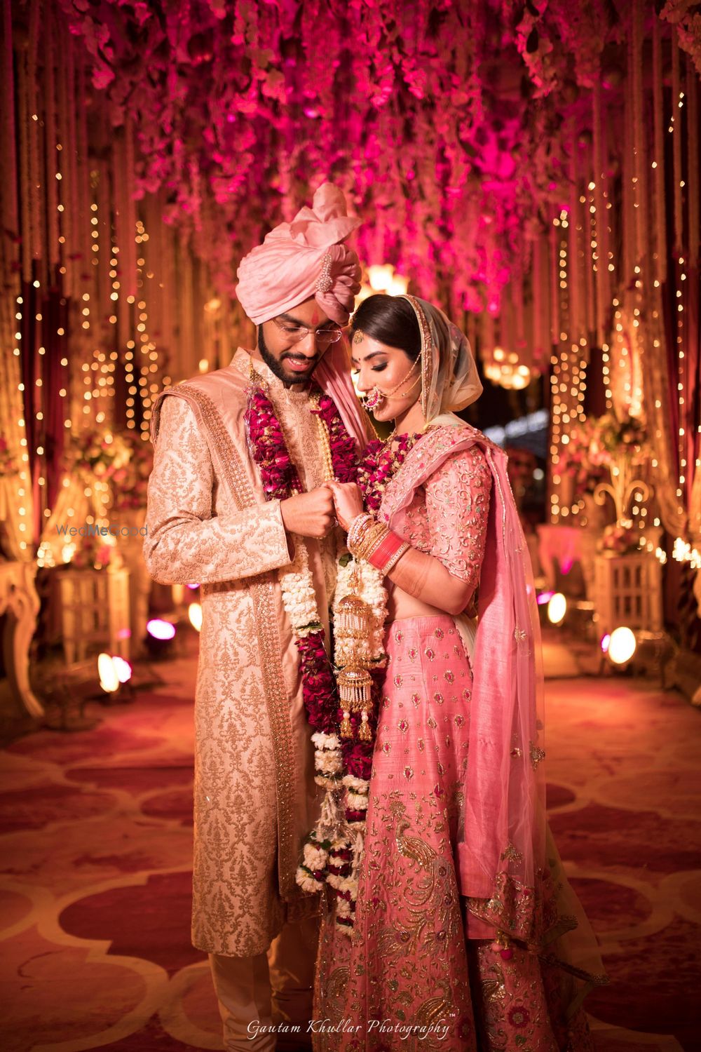 Photo of A couple pose on their wedding day