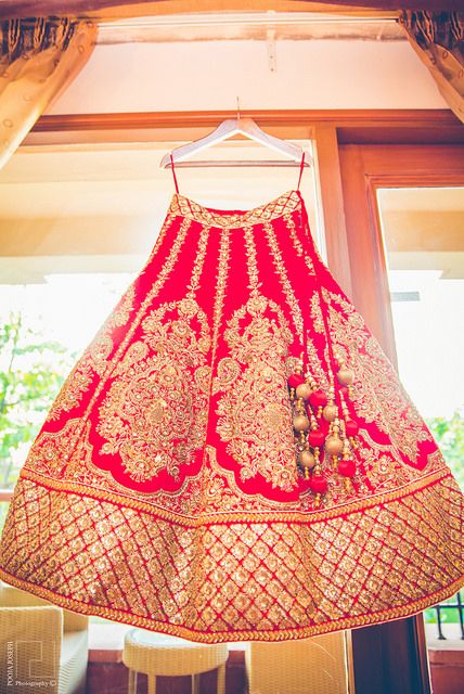 Photo of red and gold bridal lehenga