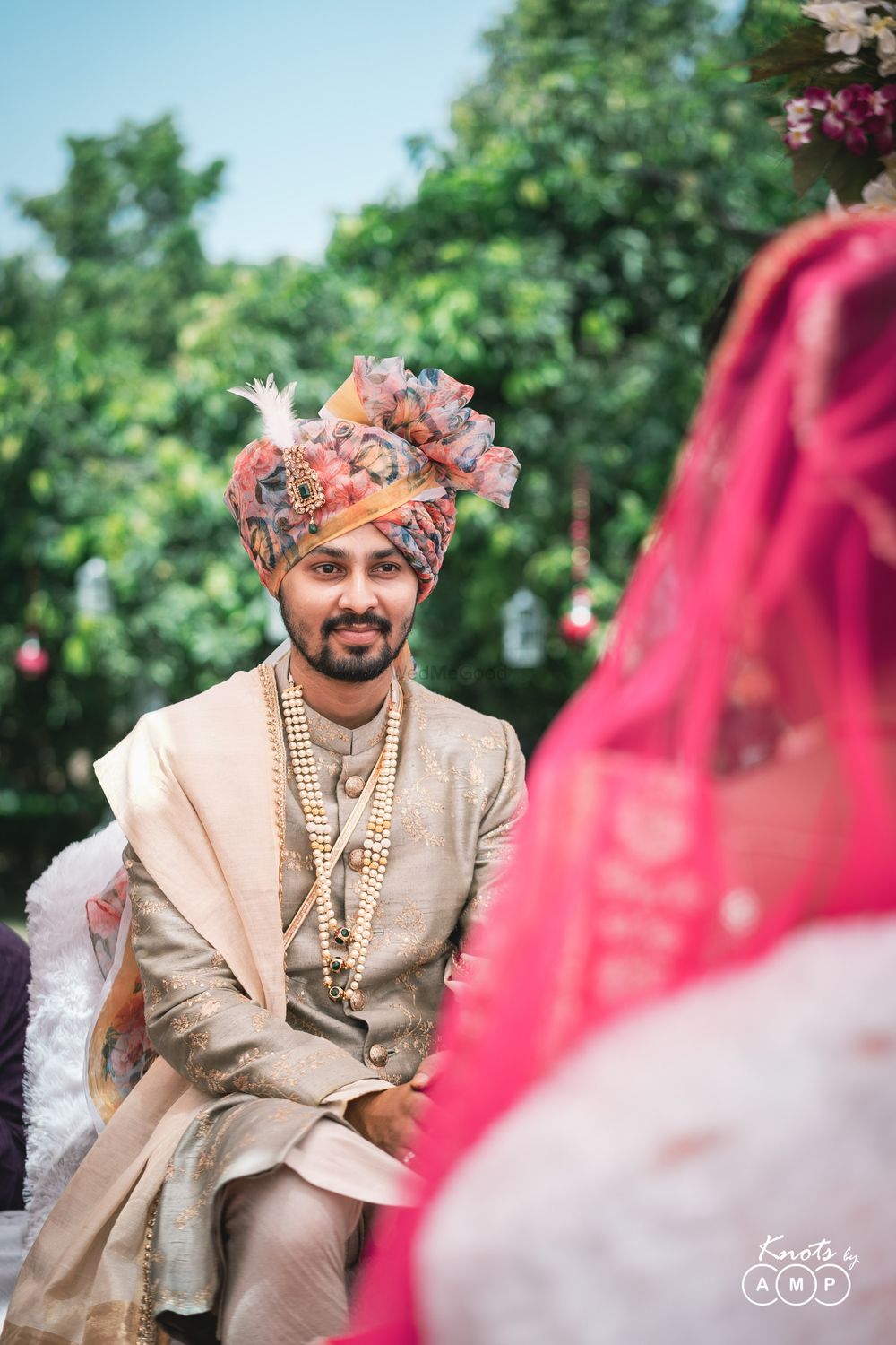 Photo of Groom in grey sherwani with contrasting floral safa
