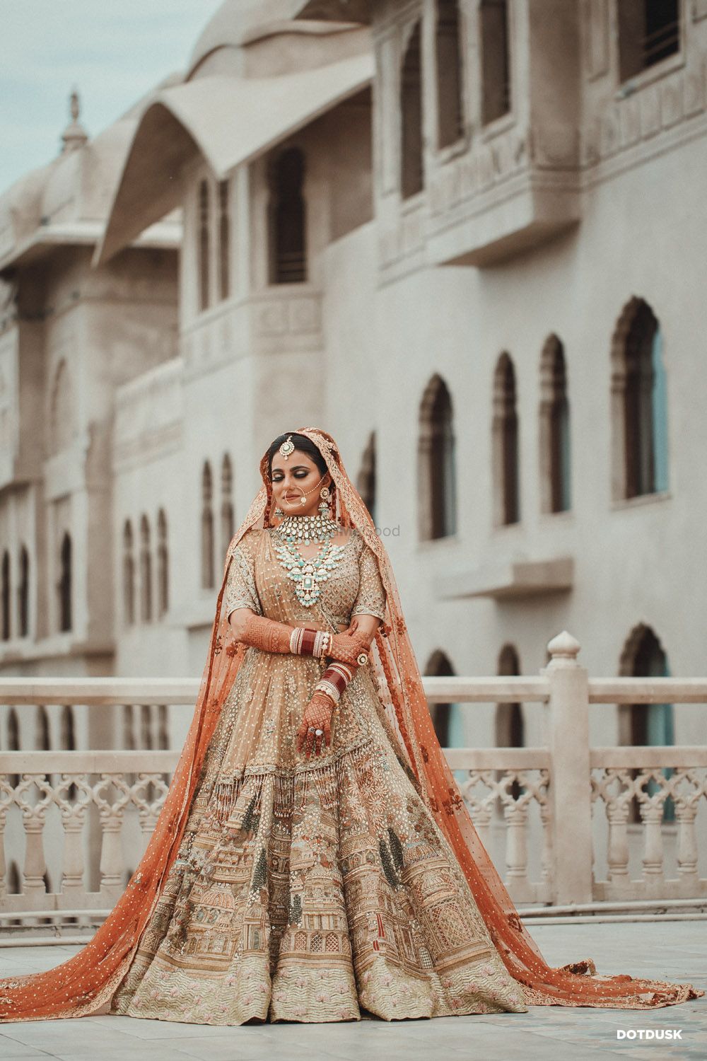 Photo of A bridal portrait with the bride in a royal lehenga