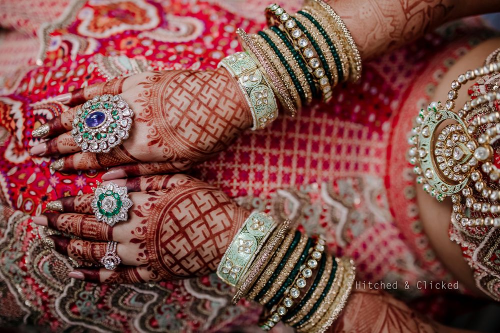 Photo of A shot of the bride's gorgeous rings and bangles on her wedding day